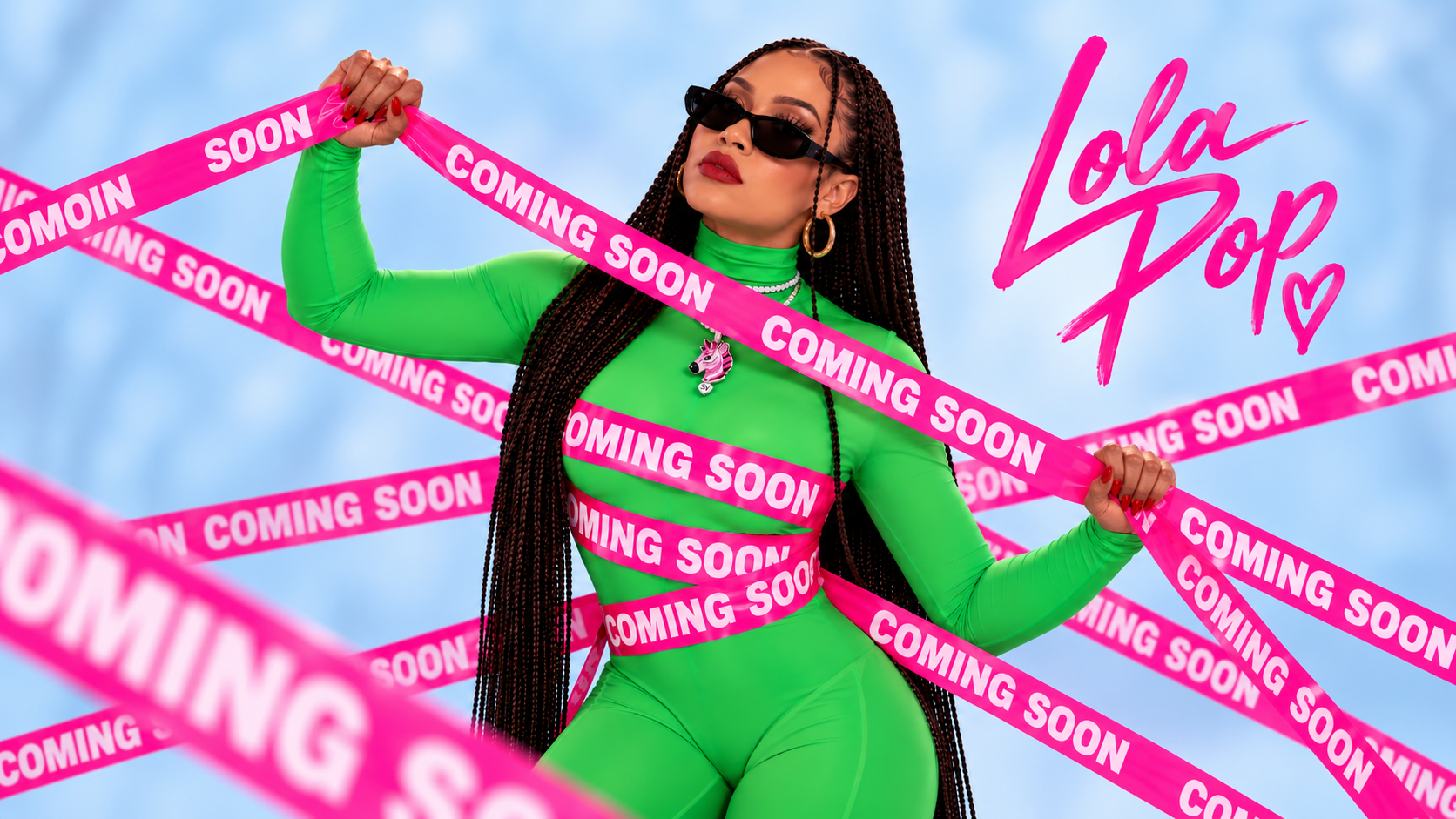 Lola Pop in green with pink Coming Soon ribbon